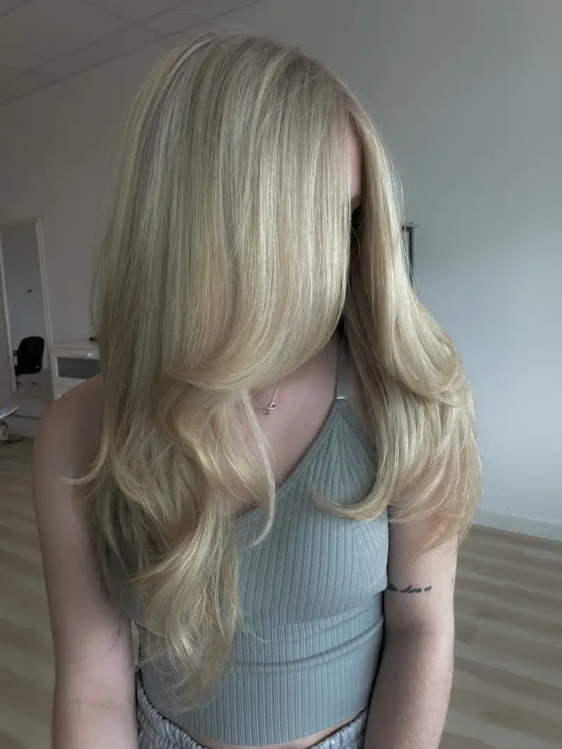 Bright blended blonde with soft face-framing layers